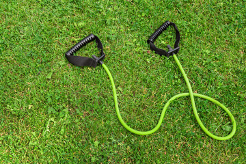 Fit tube on the green grass background © Canvas Alchemy