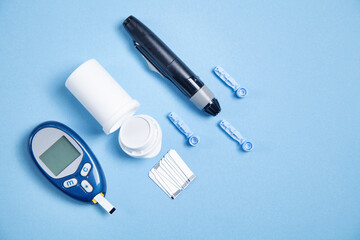 Glucometer with test strips and other objects. Devices for measuring of glucose in the blood