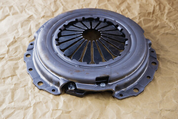 Passenger car clutch basket. Photo of a new clutch before installation on a car on a background of...
