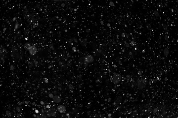 Falling white snow on black background, overlay layer