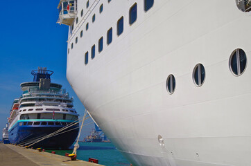 Cruiseships cruise ship liners line up in port of Civitavecchia, Rome in Italy on sunny summer day with blue sky during Mediterranean cruising