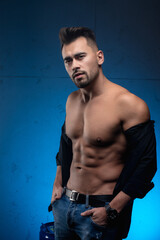 handsome man with a beard and hair adorns the press and body