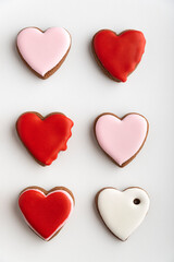 Gingerbread cookies with sugar icing on white background. Vertical frame