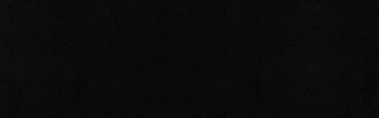 Fototapeta premium Panorama of Vintage black painted cement wall with rough surface texture and background seamless
