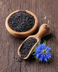 Black cumin seeds with nigella sativa flower
