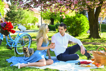 Forever yours. having picnic in city park. man and woman relax with food basket. Romantic traveler...