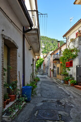 Fototapeta na wymiar A small street between the old houses of Sant'Angelo d'Alife, a mountain village in the province of Caserta, Italy.