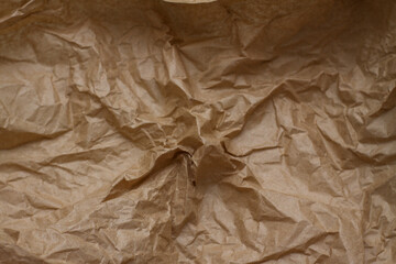  crumpled paper. craft paper. texture, background, folds.brown crumpled paper