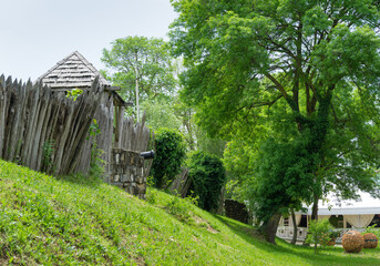 Shady street of Arkhipo-Osipovka village with detail of Museum complex Mikhailovskoe fortification. Tranquil Black Sea resort in Krasnodar area.  Arkhipo-Osipovka Gelendzhik
