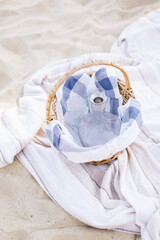 a jug of fresh water in a wicker basket. picnic on the beach
