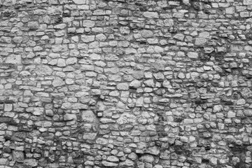 Gray panorama stone wall for background design. Natural stone wall textured background