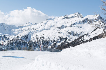 View of the snow-capped mountain peaks of the Dolomites against the sky. Concept background, landscape