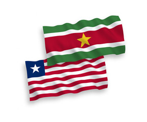 Flags of Republic of Suriname and Liberia on a white background