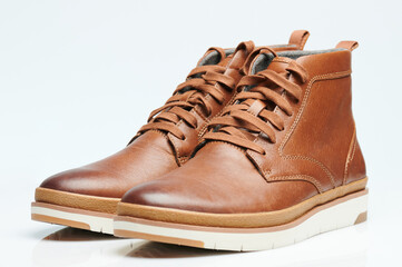 Pair of brown leather shoes isometric view