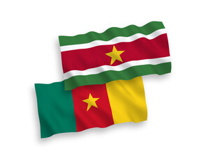 Flags of Republic of Suriname and Cameroon on a white background