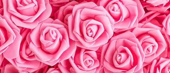 background of artificial pink flowers. pink foam range roses. soft focus