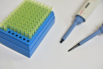 Micro pipette tip with autopipette on white background.