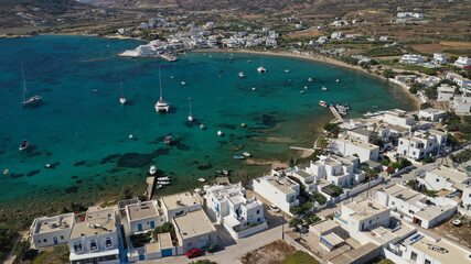 Aerial drone photo of picturesque fishing village of Polonia or Pollonia with traditional fishing boats anchored next to island of Kimolos, Milos island, Cyclades, Greece