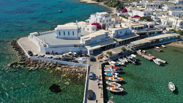 Aerial drone photo of picturesque fishing village of Polonia or Pollonia with traditional fishing boats anchored next to island of Kimolos, Milos island, Cyclades, Greece