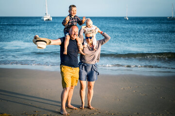 The family with two small boys enjoying time on the beach in Portugal