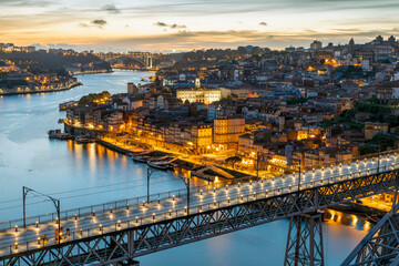 Fototapeta premium Skyline of the historic city of Porto with famous bridge at night, Portugal