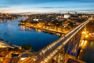 Fototapeta na wymiar Skyline of the historic city of Porto with famous bridge at night, Portugal