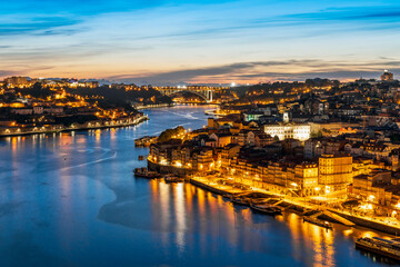Fototapeta na wymiar Skyline of the historic city of Porto with famous bridge at night, Portugal