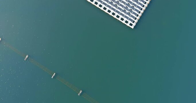 Aerial view of Floating solar panels cell platform system park farm on the pond