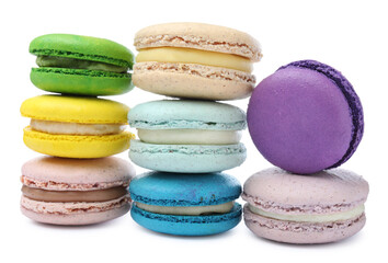 Different delicious colorful macarons on white background