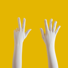 hands with white glove on yellow sunny summer background. modern summer abstract art. mimalism