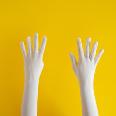 hands with white glove on yellow sunny summer background. modern summer abstract art. mimalism