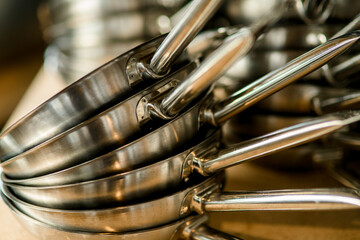 close-up of clean pans on top of each other. Kitchen equipment and utensil