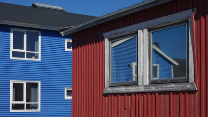 window in colorful buildings and reflection,  Sisimut, Greenland