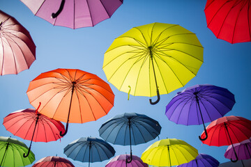 Colorful umbrellas against the sky.