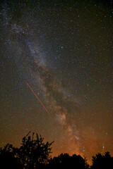 Milky way with the airplane crossing.