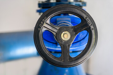 Closeup of wheel handle to control flow by open and shut positions in an Industry