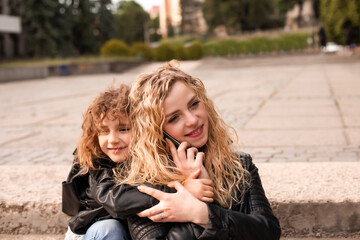 The busy mom with daughter while are walking