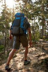 Rear view of middle aged caucasian man with backpack