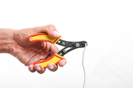 electric wire cutter holding in hand