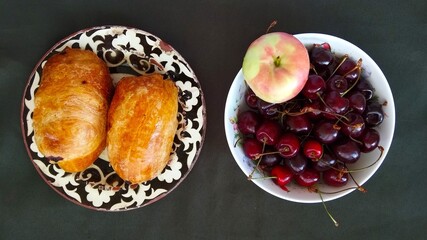 Fruit and samosas on the plates