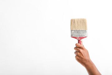 male hand and red brush isolated on white background
