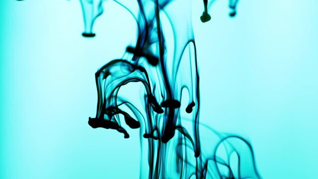 Abstract Video of Blue Ink Released Above in Water on Light Blue Background