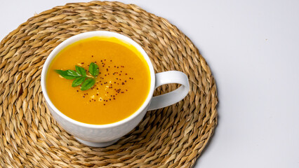 Pumpkin soup  on a bowl