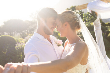 Happy caucasian bride and groom getting married and dancing