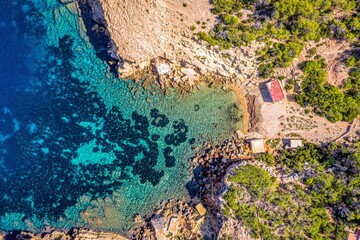 aerial view of a small port and beach in the mountains of mallorca island