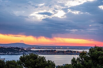 sunset over the sea and the city of palma de mallorca