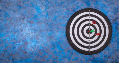 Aim goal, hitting target simply business concept. Dartboard and arrows
