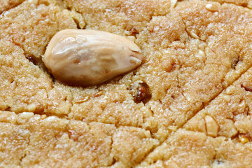 Helbeh fenugreek cake close-up view. Homemade traditional dessert.