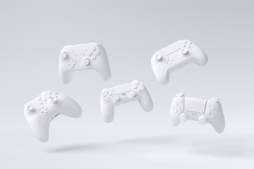 Flying gamer joysticks or gamepads on white background © Vasyl Onyskiv