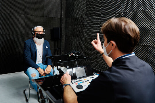 Senior man and doctor in room for audiological test